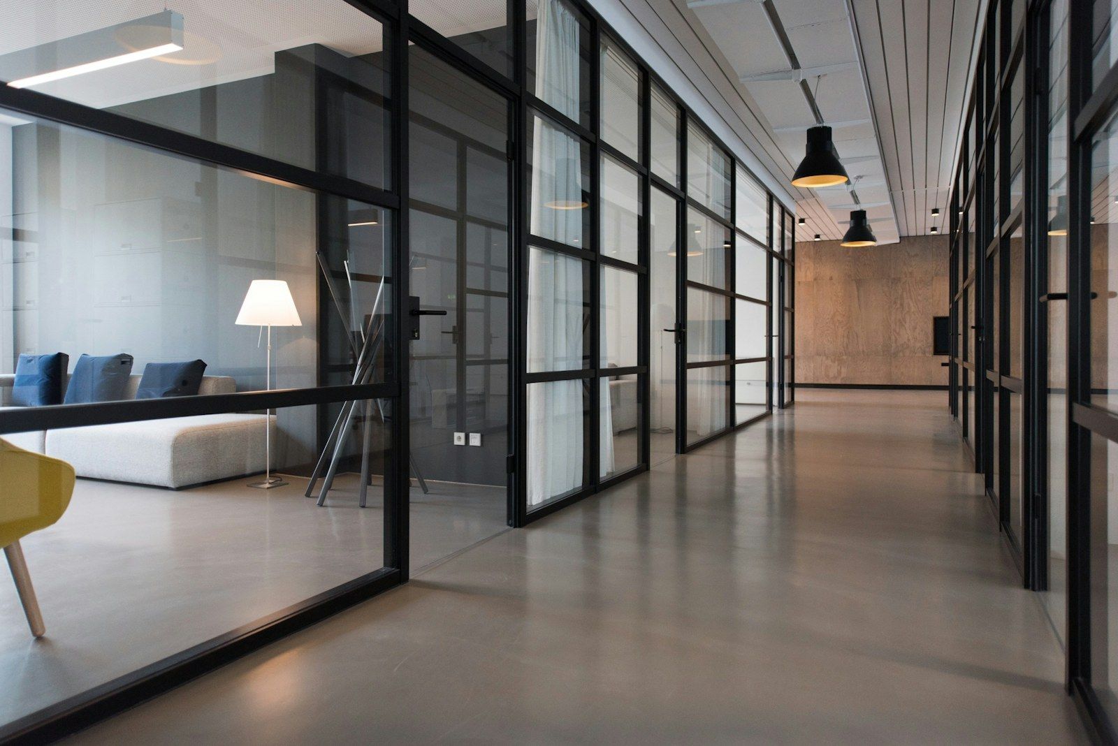 A clean, empty office corridor with polished floors